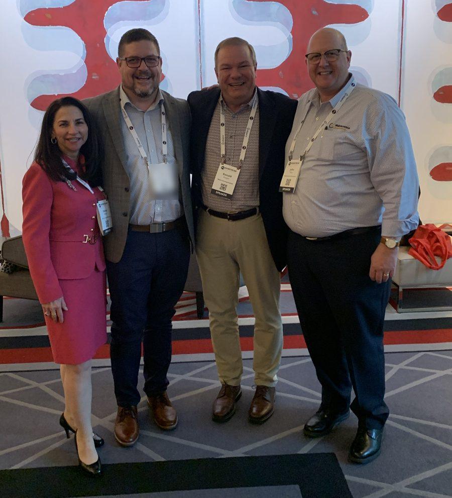 Nancy Regan, Steve Baumgartner, Rob Rieger and Dr. John Ross with speaker badges at the Mainstream Conference